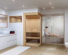 a bathroom with a large glass shower door