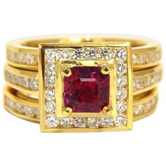 GIA Certified 1.51Ct Natural Ruby Ring Report: 5171034909 Octagonal cut (asscher cut) Excellent color stability Pigeon Blood Red. Excellent cut Clean Clarity Thailand Origin Round Diamonds: 2.00ct. G-color Vs-2 clarity. 18kt. yellow gold (3) Rings Sizes: 6.75 & can be resized, please inquire first. Deck of center ring: .45 X .48 inch depth: .30 inch Each band: .11 inch wide Natural Ruby Ring, Diamonds Ring, Asscher Cut, Wide Rings, Modern Ring, Blood Red, Ruby Diamond, Red Ruby, Shop Engagement Rings