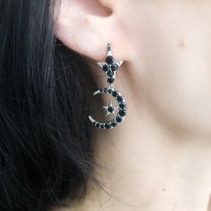 Inspired by our research into the Victorian era and the beautiful pieces of that time we created these replica earrings with a witchy addition of moons and stars. A beautiful piece for Vampire Bride in all of us. And there's a matching necklace if you want the set! Black jet glass stones set in an antiques silver finish. Brass based with surgical steel posts. 1 1/2" long. All orders over $50 ship for free within the USA. All orders usually ship within 24 hours from the USA. Elegant Moon Phase Dangle Jewelry, Gothic Sterling Silver Jewelry For Parties, Silver Moon-shaped Jewelry For Party, Party Jewelry With Moon Charm, Elegant Moon-shaped Party Jewelry, Pierced Witchy Earrings For Gift, Witchy Style Pierced Earrings As Gift, Witchy Pierced Earrings As Gift, Witchy Style Pierced Earrings For Gift