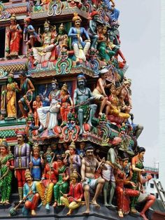 a very tall tower with many different statues on it