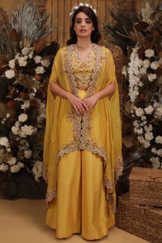 Featuring a yellow scalloped cape in organza and silk base. It is paired with a matching crop top and palazzo pants.  FIT: Fitted at bust and waist. COMPOSITION: Organza, Silk. CARE: Dry clean only Outfit For Engagement, Top And Palazzo Pants, Cape Set, Indian Outfits Lehenga, Organza Lehenga, Indian Bridal Dress, Kurti Designs Party Wear, New Address, Party Wear Indian Dresses