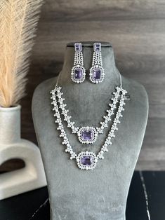 Adorn yourself with elegance and grace with our exquisite collection of necklace sets, perfect for every occasion. Our Purple Indian Necklace Set boasts stunning craftsmanship and vibrant hues, adding a touch of regal charm to your ensemble. For a timeless sparkle, indulge in our CZ Diamond Necklace Set, meticulously designed to exude luxury and sophistication. Step into the limelight with our American Diamond Necklace Set, radiating brilliance and glamour with every wear. Elevate your style wit Formal Cubic Zirconia Jewelry Sets With Stone Work, Indian Necklace Set, American Diamond Necklace Set, American Diamond Necklaces, Necklace Set Indian, Indian Necklace, Pakistani Bridal Dresses, Diamond Necklace Set, Necklace Sets