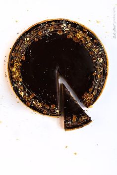 a piece of chocolate cake with gold sprinkles