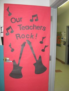 a door decorated with an image of guitars and musical notes that says our teachers rock