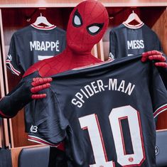 spider - man jersey being held by two men