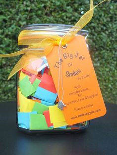 a jar filled with colorful sticky notes and a tag on the lid that says, tongue jam of smiles