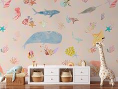 an animal themed wallpaper in a child's room with toys on the floor