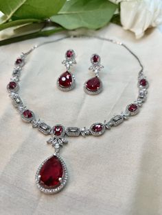 Unveil your inner elegance with our Red Ruby Cubic Zirconia Jewelry Set featuring a captivating necklace. This exquisite collection highlights the rich allure of vibrant red rubies, each piece masterfully crafted to perfection. Perfect for adding a touch of luxury and sophistication to any occasion, this set exudes timeless beauty and refined craftsmanship. Experience the enchanting charm of our Red Ruby Cubic Zirconia Jewelry Set and make a bold statement. Ruby Jewelry Set, Cubic Zirconia Jewelry, Red High, Ruby Jewelry, Wedding Jewellery, Red Ruby, Wedding Jewelry Sets, High Jewelry, Vibrant Red