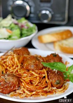 spaghetti with meatballs and salad on the side