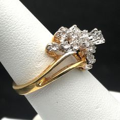 Vintage Ring RSC 18KGE CZ Cocktail Statement Ring with Elegant Spill of Clustered Sparkle Measurement * Size 7 Condition * Very nice condition. Gently used. There is a loss of plating to bottom inside of the band. Please see pics, priced accordingly. Cluster 14k Gold Diamond Ring For Anniversary, Yellow Gold Cluster Ring For Promise, Yellow Gold Cluster Promise Ring, 14k Gold Cluster Diamond Ring For Anniversary, Gold Cluster Rings With Diamond Cut, Gold Cluster Diamond Ring With Accents, Yellow Gold Cluster Diamond Ring For Anniversary, Yellow Gold Diamond Cluster Ring For Anniversary, Gold Cluster Rings With Brilliant Cut