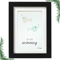 a white and black frame with two fish in it