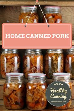 some jars filled with food sitting on top of a wooden shelf next to a sign that says home canned pork