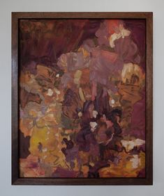 an abstract painting hanging on the wall