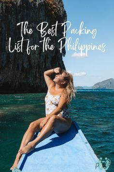 a woman sitting on top of a boat in the ocean with text reading the best packing list for the philippines