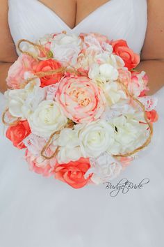 the bride's bouquet is made up of peach and white flowers