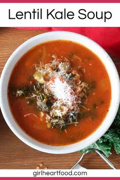 a bowl of lentil kale soup with parmesan cheese in the middle