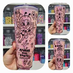 the tumbler cup is decorated with pink glitter and has an image of a cartoon character on it