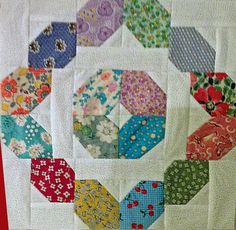 a close up of a quilt on a table