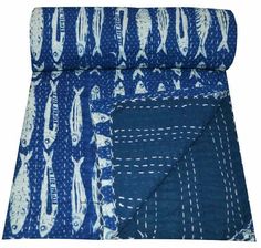 the blue and white fabric is folded up on top of each other, with two different patterns