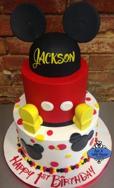 a mickey mouse birthday cake with the name jackson on it's top and ears