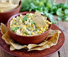 a bowl of corn salsa with tortilla chips