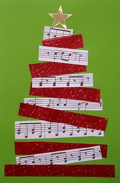 a christmas tree made out of strips of paper with music notes on it and a star