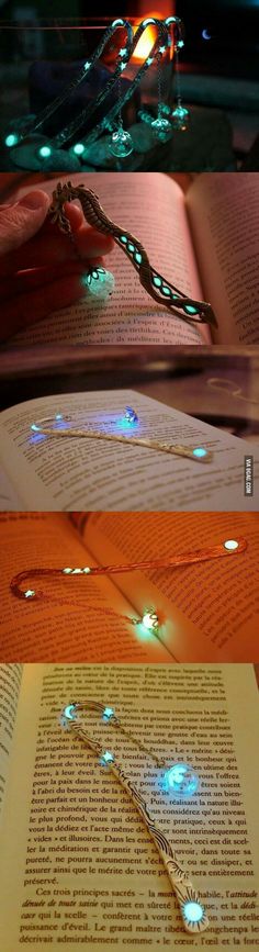 an open book with some lights on it and the pages are lit up in different colors