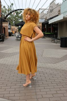 Look stylish in this gorgeous Jessica Crop and Midi Skirt Set. Crafted with a golden mustard color, the comfortable crop top and flowy midi skirt have an effortless casual look. Made of 80% polyester and 20% rayon, this set is perfect for any occasion. Chic Summer Skirt Set With Short Sleeves, Spring Two-piece Cropped Dress, Spring Two-piece Skirt Set For Day Out, Casual Gold Skirt For Summer, Gold Short Sleeve Midi Dress For Summer, Spring Two-piece Crop Top With Short Sleeves, Two-piece Short Sleeve Crop Top For Spring, Spring Two-piece Short Sleeve Crop Top, Two-piece Cropped Crop Top For Day Out