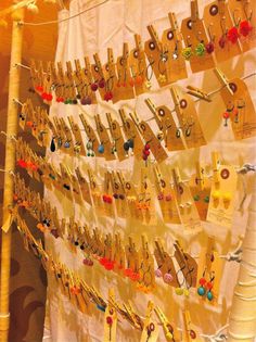 there are many pairs of earrings hanging on the wall