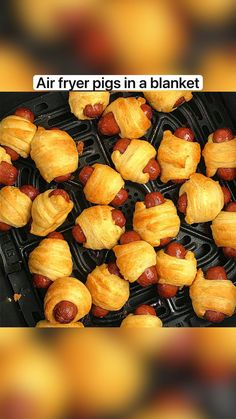 there are many pieces of food in the air frying pans that look like pigs in a blanket