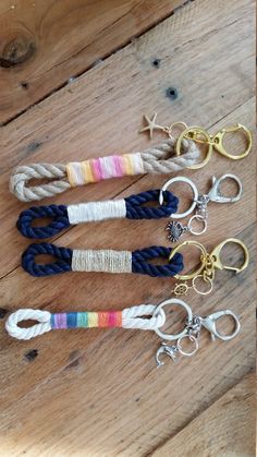 several different types of rope and scissors on a wooden floor with wood planks in the background