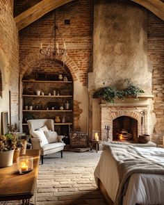 a bedroom with brick walls and an arched doorway leading to a bed in front of a fireplace