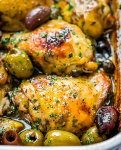 chicken and olives in a white casserole dish