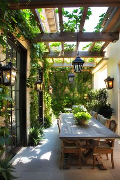 an outdoor dining area with wooden table and chairs, surrounded by greenery on the walls