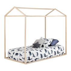 a bed with a canopy and pillows on top of it, in front of a white background