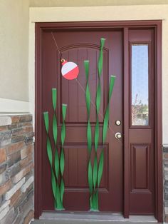 the front door is decorated with green grass