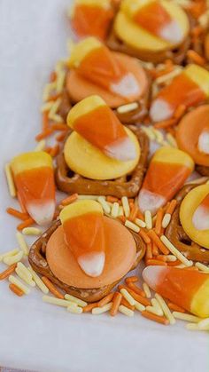 some food is laying out on a white plate with orange and yellow toppings in the middle