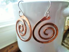 Sterling Silver and Copper Swirl Earrings Mixed Metal Jewelry 100% handmade by me with love & energy, comes in a hand-sewn gift pouch also made by me <3 Your earrings measure about 2.25 inches long. Please choose from Copper, Oxidized Copper or Brass swirls To reduce our Carbon Footprint as a business we will no longer be sending a color copy of your invoice in each package, a copy of your invoice is available in your Etsy account under purchases. If you must have a printed copy of your o Aztec Earrings, Wire Jewelry Earrings, Copper Crafts, Copper Jewellery, Metalsmithing Jewelry, Mixed Metal Jewelry, Swirl Earrings, Oxidized Copper, Love Energy