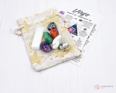 various rocks and stones on a cloth bag with the word virgo written below it