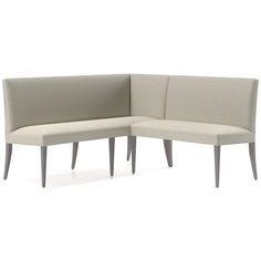 the corner sofa is made from fabric and has two legs on each side, with one end