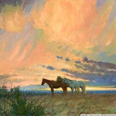 two horses standing in the grass under a cloudy sky