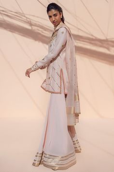 Lea – Sania Maskatiya International Pink Georgette Kurta With Gota Work, Peach Sharara With Resham Embroidery, Pink Chanderi Palazzo Set With Sheer Dupatta, Designer Peach Sharara With Chikankari Embroidery, Peach Sharara With Dabka Work For Weddings, Designer Peach Dupatta With Gota Work, Pink Palazzo Set With Sheer Dupatta For Reception, Elegant Peach Unstitched Suit With Dupatta, Peach Traditional Wear With Gota Work For Designer Occasions