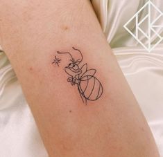 a small tattoo on the arm of a person