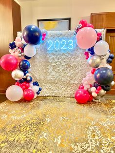 balloons and streamers decorate the entrance to a new year's eve party