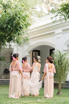 the bridesmaids are getting ready to walk down the aisle in their pink dresses