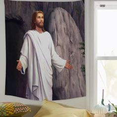 a painting of jesus with his arms outstretched in front of a rock and mountain backdrop