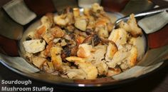 a close up of a bowl of food on a table with a spoon in it