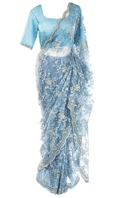 Saree is pre-stitched Saree is pre-pleated Matching underskirt is included 2 Blouse options:Option 1: Sleeved blouse with an adjustable drawstring back and padded insertsOption 2: Spaghetti strap blouse See Size Guide for sizing detail.A gorgeous lacy net Saree embellished with beaded blue and silver florals and shimmering rhinestones all over, especially the bejeweled scallop border. In this outfit, the skies are never gray. Blue Sari, Spaghetti Strap Blouse, Strap Blouse, Stitched Saree, Scallop Border, Spaghetti Strap Blouses, Western Wear Dresses, Net Saree, Clear Blue Sky