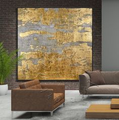 a living room filled with furniture and a large painting on the wall