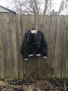 This is a great jacket for anyone that wants something different. If you want to look great anywhere you go, this is for you. If you are a public account in Ohio, it would be even better. It has some staining, pictured, but is still amazing. There are no rips, holes or smells. Measurements: Pit to pit: 24 1/4 inches Collar to bottom front: 23 inches Collar to bottom back: 25 inches 32 inches Sleeve Length (from collar): Size on tag: Large Black Varsity Jacket With Buttons, Classic Black Cotton Varsity Jacket, Black Buttoned Outerwear For College, Casual Black Sport Coat For College, Classic Black Windbreaker For Streetwear, Casual Nylon Outerwear For College, Retro Black Windbreaker For Outdoors, Retro Black Windbreaker For Outdoor, Classic Collared Windbreaker For Streetwear